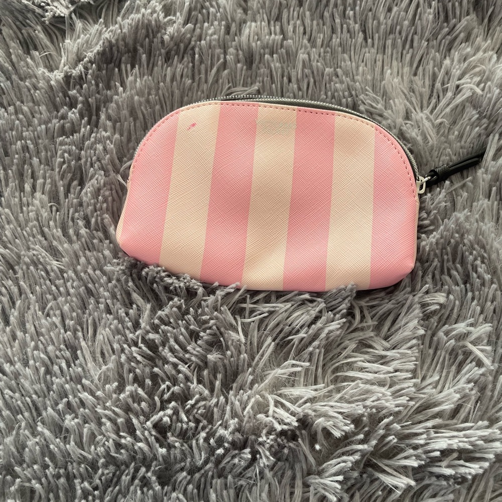 Used small makeup pouch pink and white color.